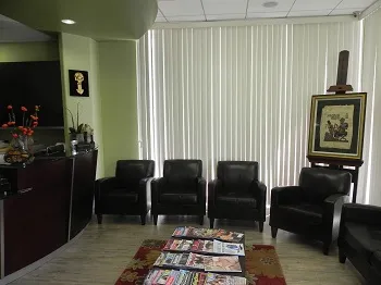 Dr. Margossian's waiting room for patients with reading materials and chairs